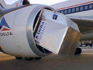 DC-10 sucks up a foreign object. A jet engine is the largest vacuum cleaner in the world.